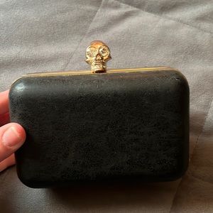 Classic and edgy distressed leather gold skull clutch